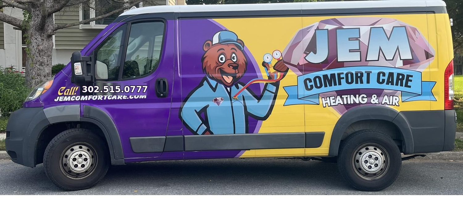 JEM Comfort Care service van in purple and yellow with the Care Bear mascot